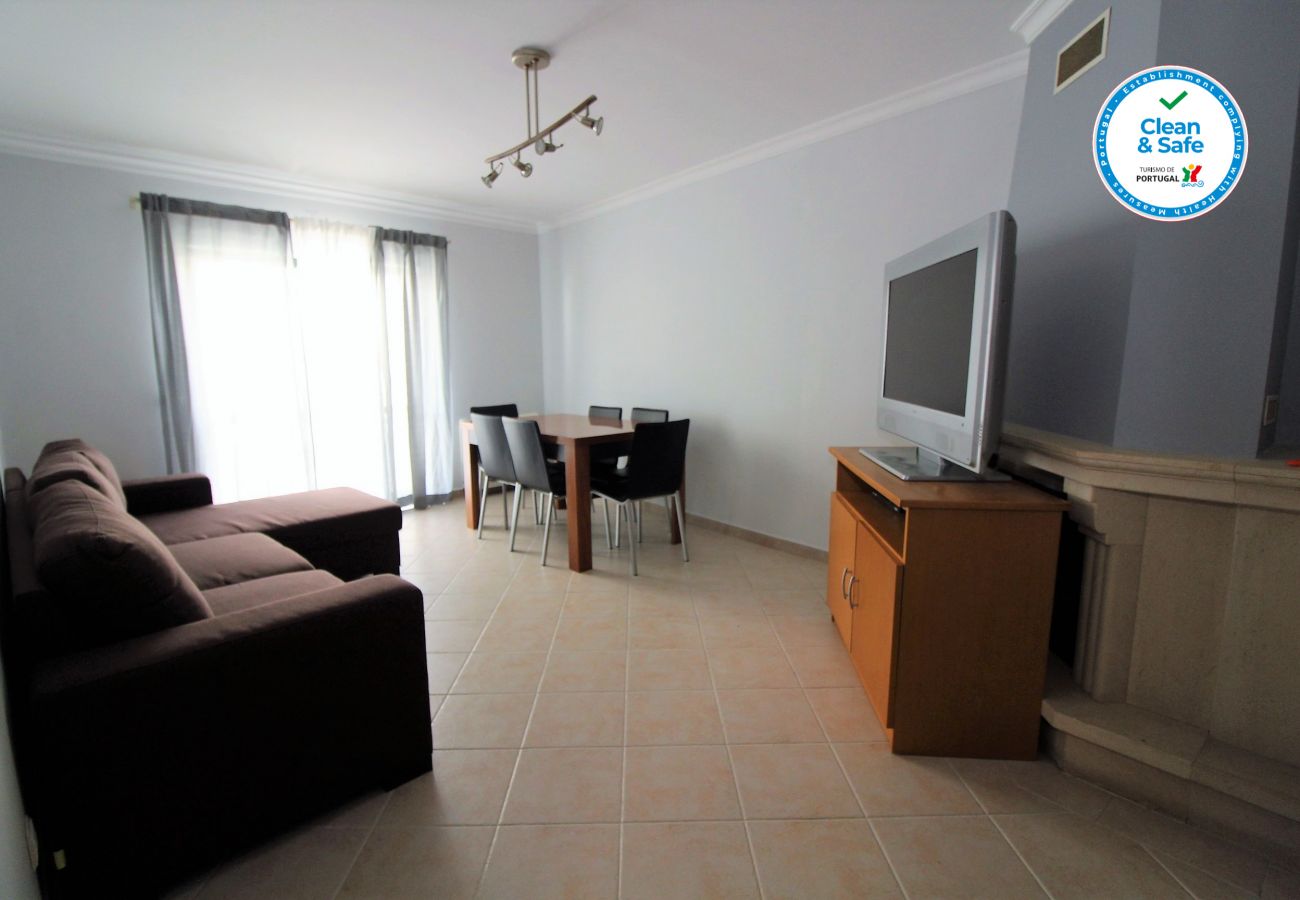 Living room with sofa, dining table for 6 people, TV, Wifi, Air conditioning